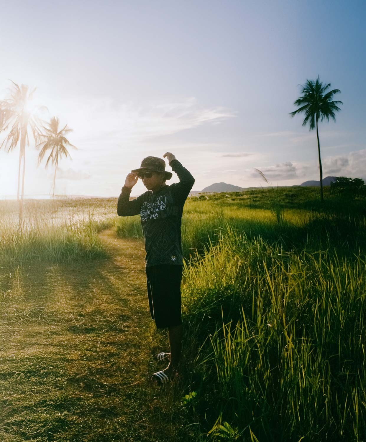 Portrait of the blog owner with face partially distorted through two clear glasses of water on a white table